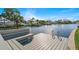 Waterfront dock with boat lift, offering serene views of the tranquil waterway and the neighborhood at 5101 Huntington Ne Cir, St Petersburg, FL 33703