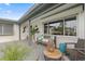 Cozy front porch with comfortable seating, lush greenery, and a welcoming atmosphere, enhancing curb appeal at 5101 Huntington Ne Cir, St Petersburg, FL 33703