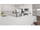 Modern kitchen featuring quartz countertops, stainless steel appliances, and white cabinets for a sleek design at 5101 Huntington Ne Cir, St Petersburg, FL 33703