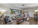 Living room with plush seating, a wooden coffee table, and ample natural light at 5101 Huntington Ne Cir, St Petersburg, FL 33703