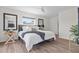 Bright bedroom with wood floors, ceiling fan, and bedside lamps at 5101 Huntington Ne Cir, St Petersburg, FL 33703