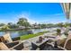 Waterfront patio with cozy seating, offering tranquil views of the canal and nearby boat docks at 5101 Huntington Ne Cir, St Petersburg, FL 33703