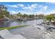 Relaxing pool with in-water loungers, overlooking a picturesque canal and boat docks at 5101 Huntington Ne Cir, St Petersburg, FL 33703