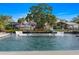 Inviting waterfront pool featuring submerged lounge chairs and a tranquil fountain for relaxing ambiance at 5101 Huntington Ne Cir, St Petersburg, FL 33703
