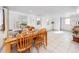 Dining area with wooden table, chairs, and tile floors at 6580 10Th Avenue S Ter, St Petersburg, FL 33707