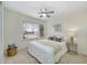 Bright bedroom with a queen-size bed and large window at 704 N Castle Ct, Tampa, FL 33612