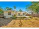 House exterior showcasing backyard patio and pergola at 704 N Castle Ct, Tampa, FL 33612