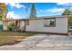 Charming single-story home with a welcoming front porch and landscaped yard at 7206 E 29Th Ave, Tampa, FL 33619