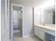 Clean bathroom showcasing a glass-enclosed shower and modern vanity with a large mirror at 7400 Sun Island Dr # 501, South Pasadena, FL 33707