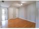 Empty bedroom with hardwood floors and multiple closets provides a blank canvas for personalization and comfort at 7400 Sun Island Dr # 501, South Pasadena, FL 33707