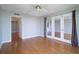 Open-concept living room with tile floors, a large window, and a door leading to a hallway at 7400 Sun Island Dr # 501, South Pasadena, FL 33707
