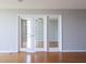 Bright living room featuring hardwood floors and french doors at 7400 Sun Island Dr # 501, South Pasadena, FL 33707