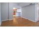 Bright, open living room with hardwood floors that lead into a kitchen area at 7400 Sun Island Dr # 501, South Pasadena, FL 33707