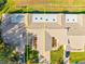 An overhead view showcasing a row of attached homes with individual two-car garages at 7497 Heather Walk Dr, Weeki Wachee, FL 34613
