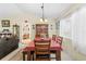 Bright dining room with a wood table and chairs, and a hutch at 7497 Heather Walk Dr, Weeki Wachee, FL 34613