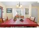 Dining area with a wooden table and red and black checkered tablecloth at 7497 Heather Walk Dr, Weeki Wachee, FL 34613