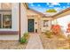 Front door entrance with brick columns and landscaping at 7497 Heather Walk Dr, Weeki Wachee, FL 34613