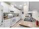 Kitchen with white cabinets, and stainless steel appliances at 7497 Heather Walk Dr, Weeki Wachee, FL 34613