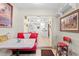 Kitchen features white cabinets and a view into the dining area at 7497 Heather Walk Dr, Weeki Wachee, FL 34613
