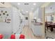 Kitchen with white cabinets and a view to the dining area at 7497 Heather Walk Dr, Weeki Wachee, FL 34613