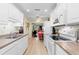 Kitchen with white cabinets and stainless steel appliances at 7497 Heather Walk Dr, Weeki Wachee, FL 34613