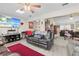 Living room with leather couches and a view into the dining area at 7497 Heather Walk Dr, Weeki Wachee, FL 34613