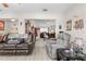 Comfortable living room with leather couches and a view to another room at 7497 Heather Walk Dr, Weeki Wachee, FL 34613