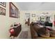 Living room with view into another room and comfortable seating at 7497 Heather Walk Dr, Weeki Wachee, FL 34613