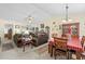 Open living and dining area with hardwood floors and a cozy atmosphere at 7497 Heather Walk Dr, Weeki Wachee, FL 34613