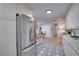 Stainless steel appliances and patterned flooring are featured in this kitchen at 8092 27Th N Ave, St Petersburg, FL 33710