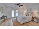 Main bedroom with a ceiling fan and access to the backyard at 8092 27Th N Ave, St Petersburg, FL 33710