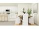 Open-concept dining area adjacent to the kitchen with white cabinetry at 9348 Runaway Breeze Dr, Land O Lakes, FL 34637