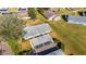 Aerial view of condo, carport, and surrounding landscape at 2204 Grenadier Dr, Sun City Center, FL 33573