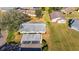 Aerial view of condo, carport, and surrounding landscape at 2204 Grenadier Dr, Sun City Center, FL 33573