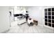 Bright kitchen featuring white cabinets, a black countertop island, and stainless steel appliances at 10708 Edgewater Ln, Tampa, FL 33612