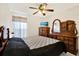 Bedroom with a double bed and wood dresser at 11835 Shrewsbury Ln, Parrish, FL 34219