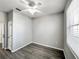 Bedroom featuring ceiling fan, neutral walls, and wood-look flooring at 1333 Misty Greens Dr, Sun City Center, FL 33573