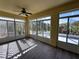 Bright Florida room with new wood-look flooring, lattice, and large windows at 1333 Misty Greens Dr, Sun City Center, FL 33573