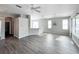 Bright and airy living room features wood-look floors and neutral paint at 1333 Misty Greens Dr, Sun City Center, FL 33573