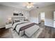 Staged main bedroom featuring wood-look floors and neutral decor at 1333 Misty Greens Dr, Sun City Center, FL 33573