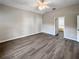 Bright and airy main bedroom with hardwood floors and en-suite bathroom at 1333 Misty Greens Dr, Sun City Center, FL 33573