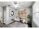 Bright office space features a modern desk, stylish shelving unit, and ample natural light from the window at 1333 Misty Greens Dr, Sun City Center, FL 33573