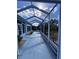 Spacious screened porch with views of a manicured yard at 1333 Misty Greens Dr, Sun City Center, FL 33573