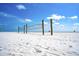 Volleyball nets set up on the white sands of Siesta Beach at 1700 Cove Ii Pl # 310, Sarasota, FL 34242