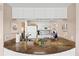 Bright kitchen with granite counters, white cabinets, and stainless steel appliances at 1700 Cove Ii Pl # 310, Sarasota, FL 34242