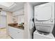 Convenient in-unit laundry area with stacked washer and dryer at 1700 Cove Ii Pl # 310, Sarasota, FL 34242