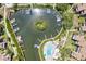Aerial view of community marina with boats and a swimming pool at 1700 Cove Ii Pl # 310, Sarasota, FL 34242