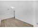 Bedroom with built-in shelving, wood-look floors, and white walls at 1708 E Poinsettia Ave, Tampa, FL 33612