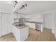 Modern kitchen with white cabinets, stainless steel appliances, and granite countertops at 1708 E Poinsettia Ave, Tampa, FL 33612