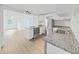 Updated kitchen featuring stainless steel appliances, granite countertops, and white cabinets at 1708 E Poinsettia Ave, Tampa, FL 33612
